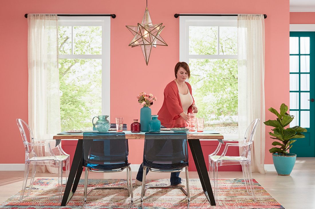 dining room with modern chairs, a doorway in bright colors