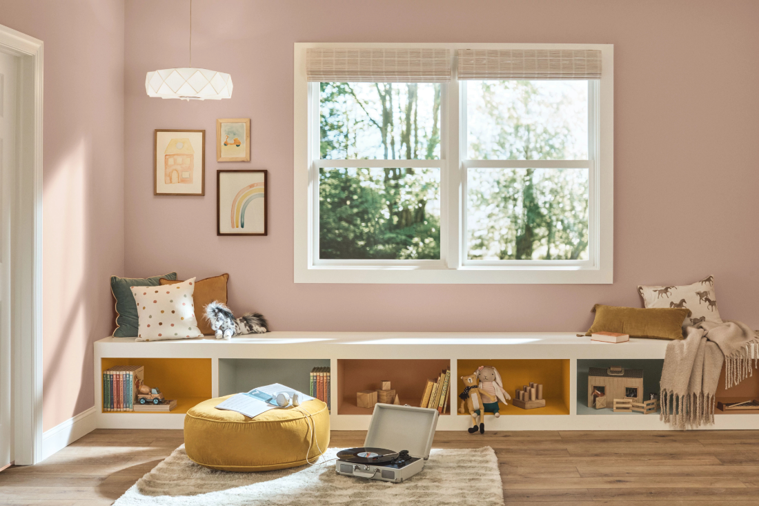 kids room with books, turntable and a large window