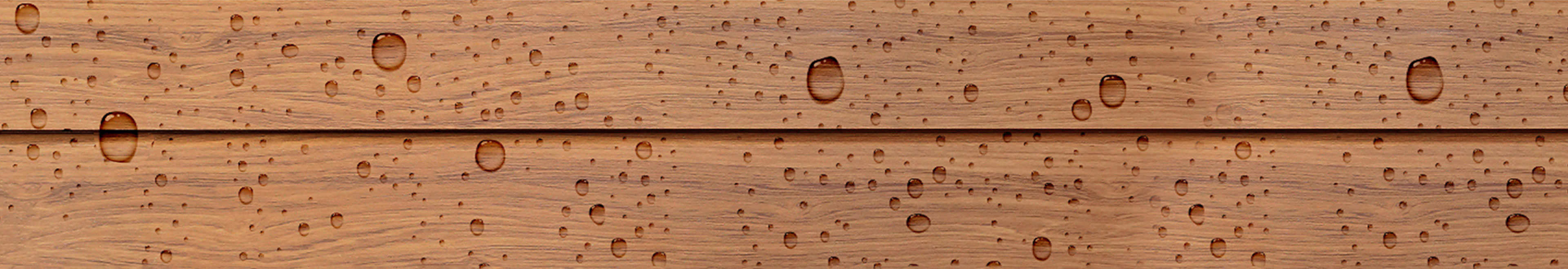 wood tabletop with water beading upon it. 
