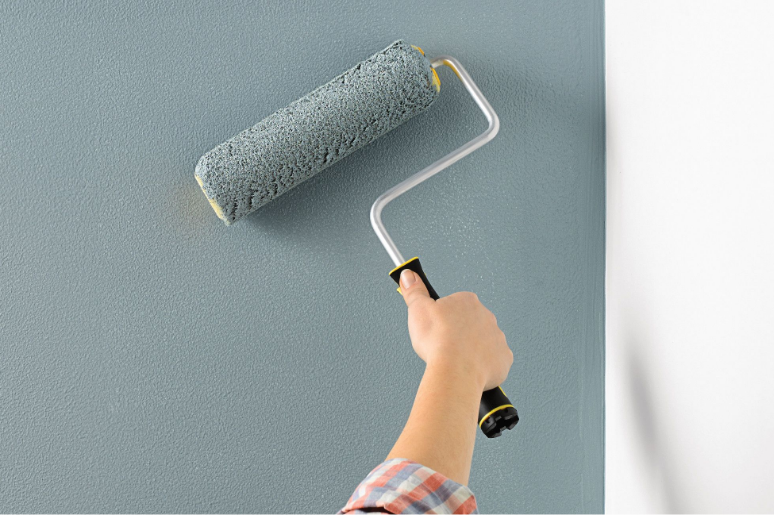 painting a wall using a roller