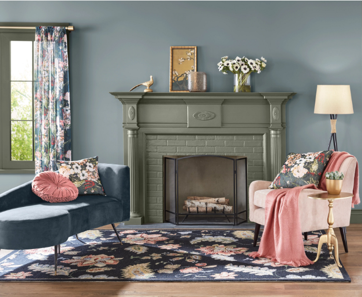 room painted blue with fireplace and chairs