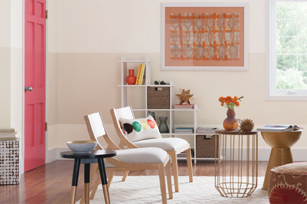 Modern-styled living room a pale colored wall with a beige stripe across it.