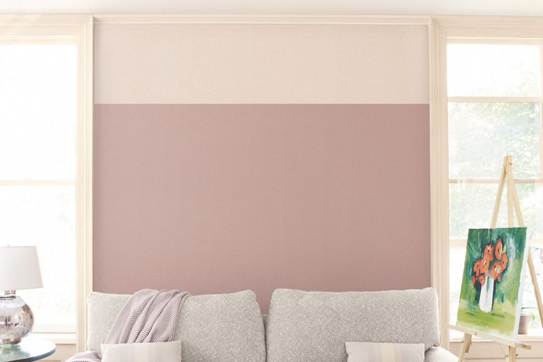 Tall living room wall with two windows. Walls feature two colors to add a pop of contrast.
