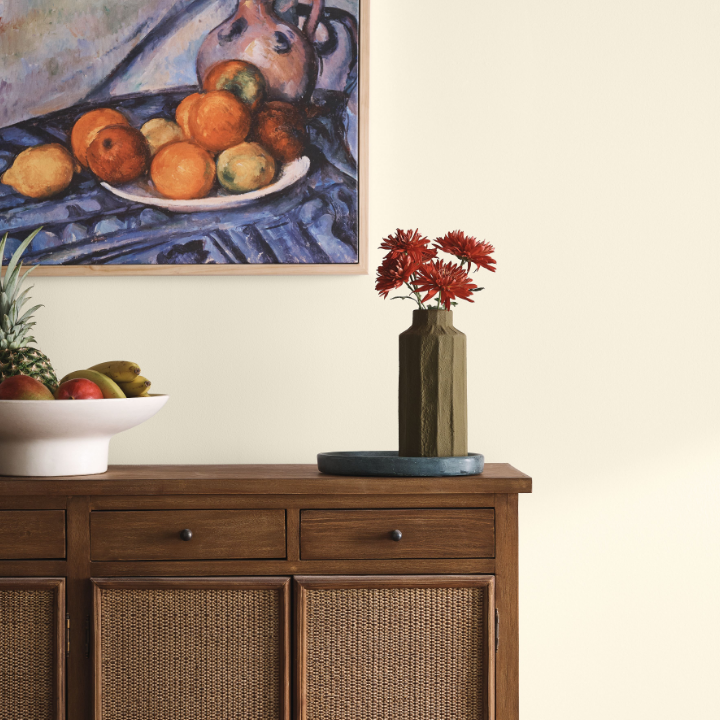 neutral wall with vase, flowers and painting