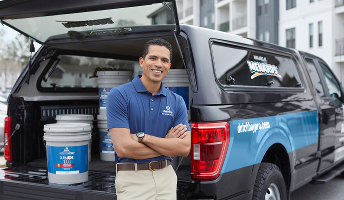 Professional standing in front of truck