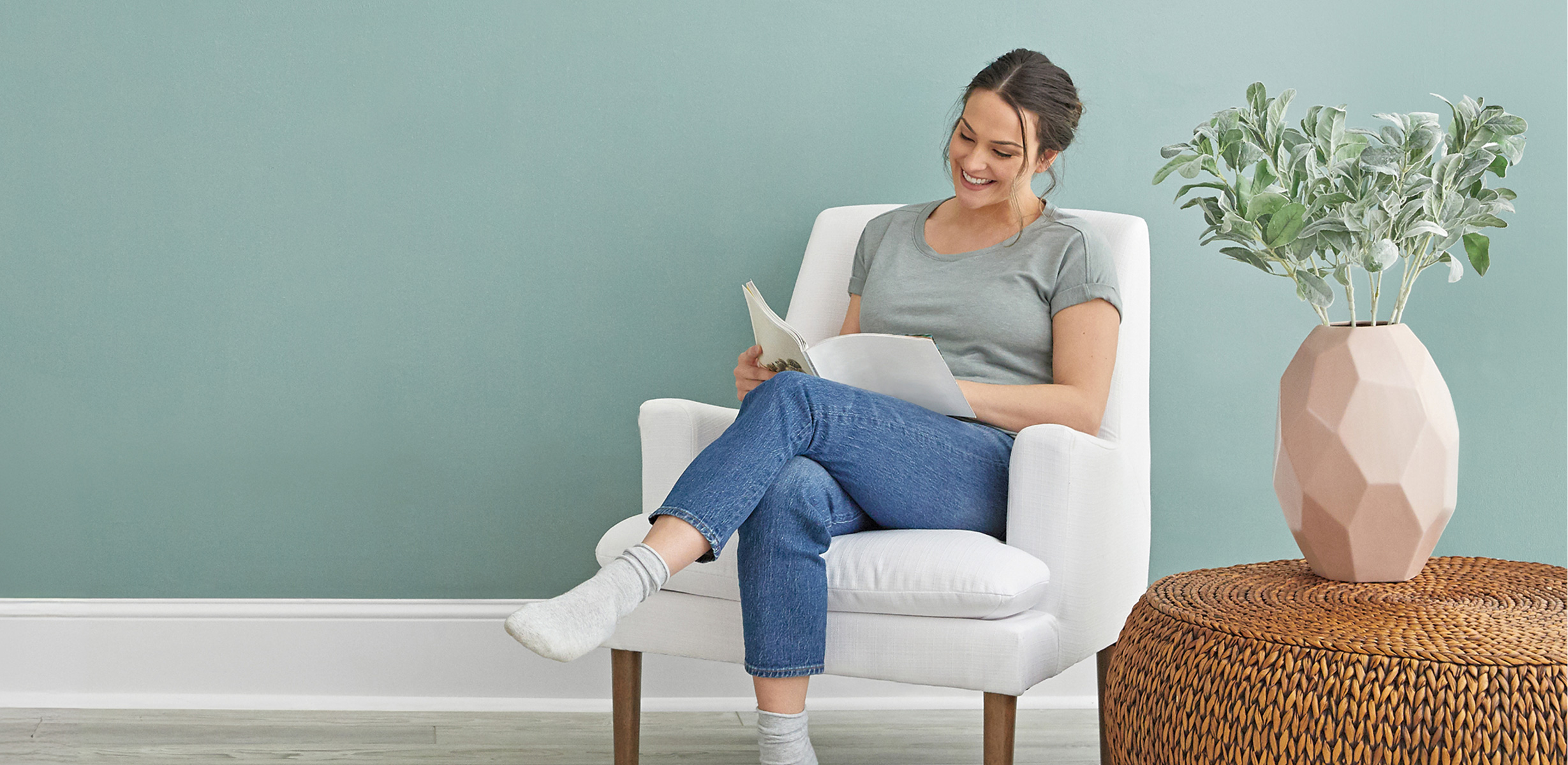 person relaxing in a chair reading