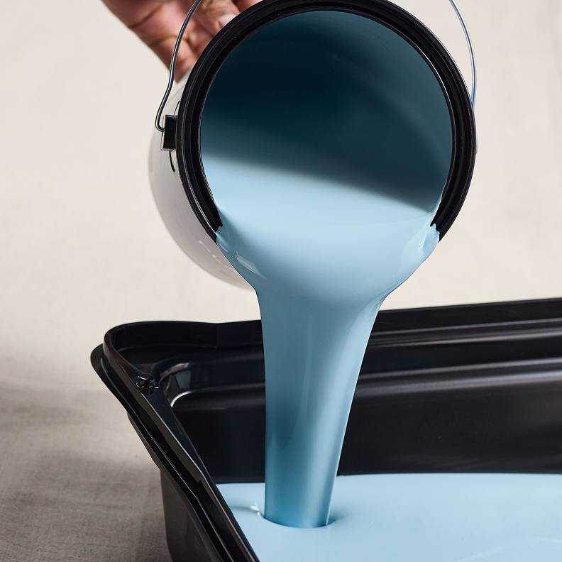 Pouring Dutch Boy paint into a tray
